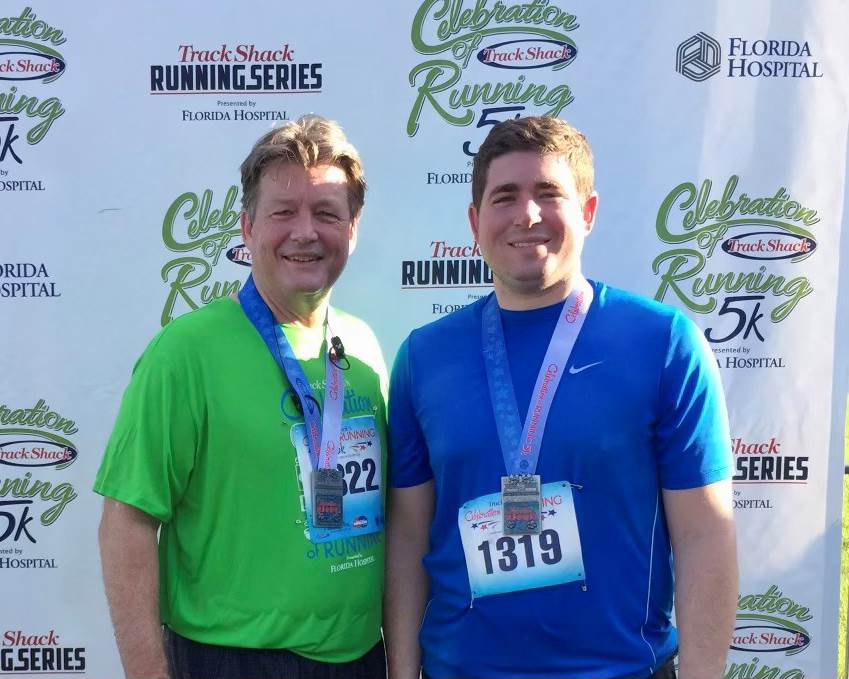 a photo of bill bradford and his son burns at a 5k event