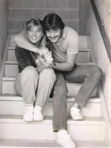Photo taken in 1981 of a man and woman embracing on stairs