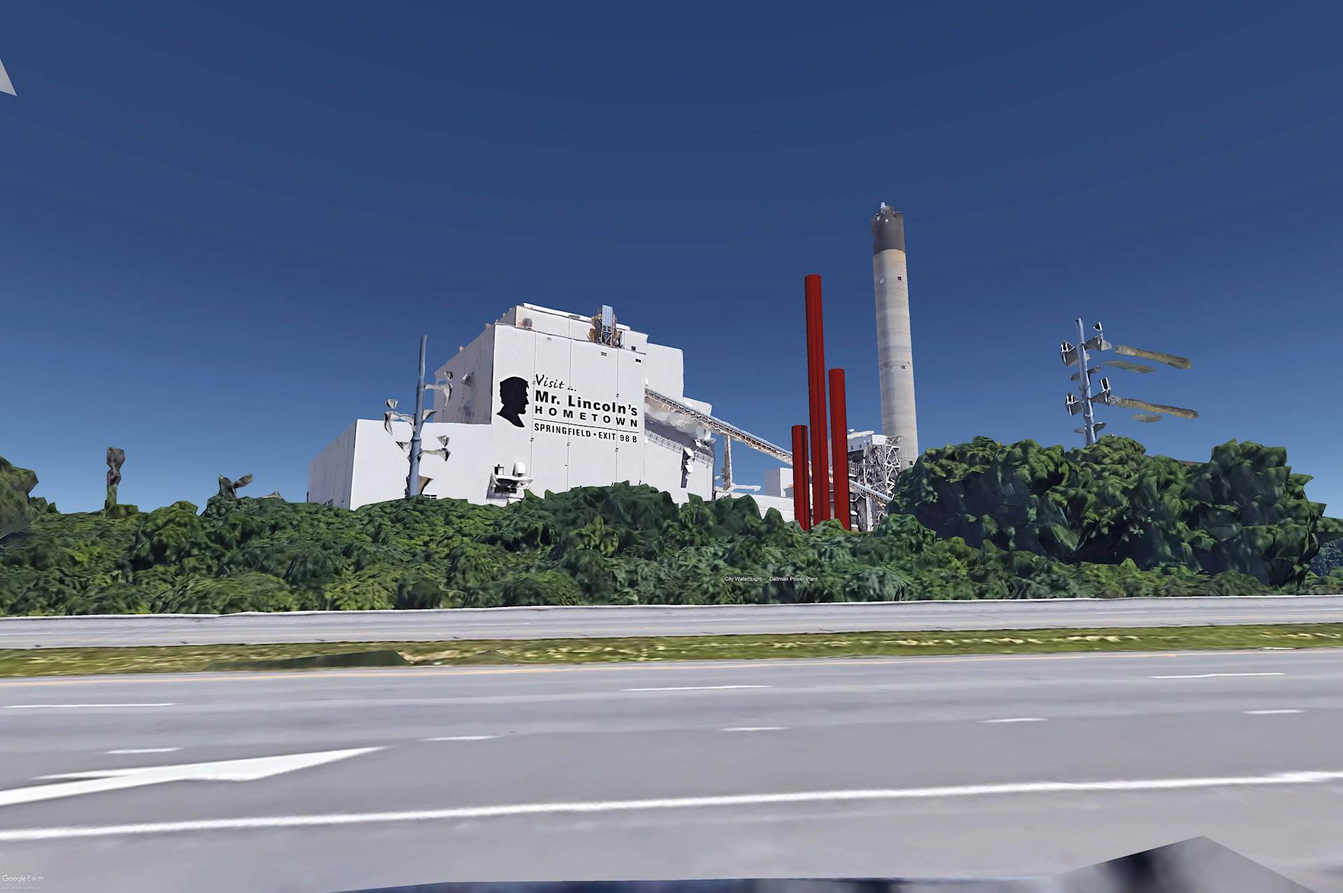 A rendering of a power plant, as seen from a tree-lined roadway.