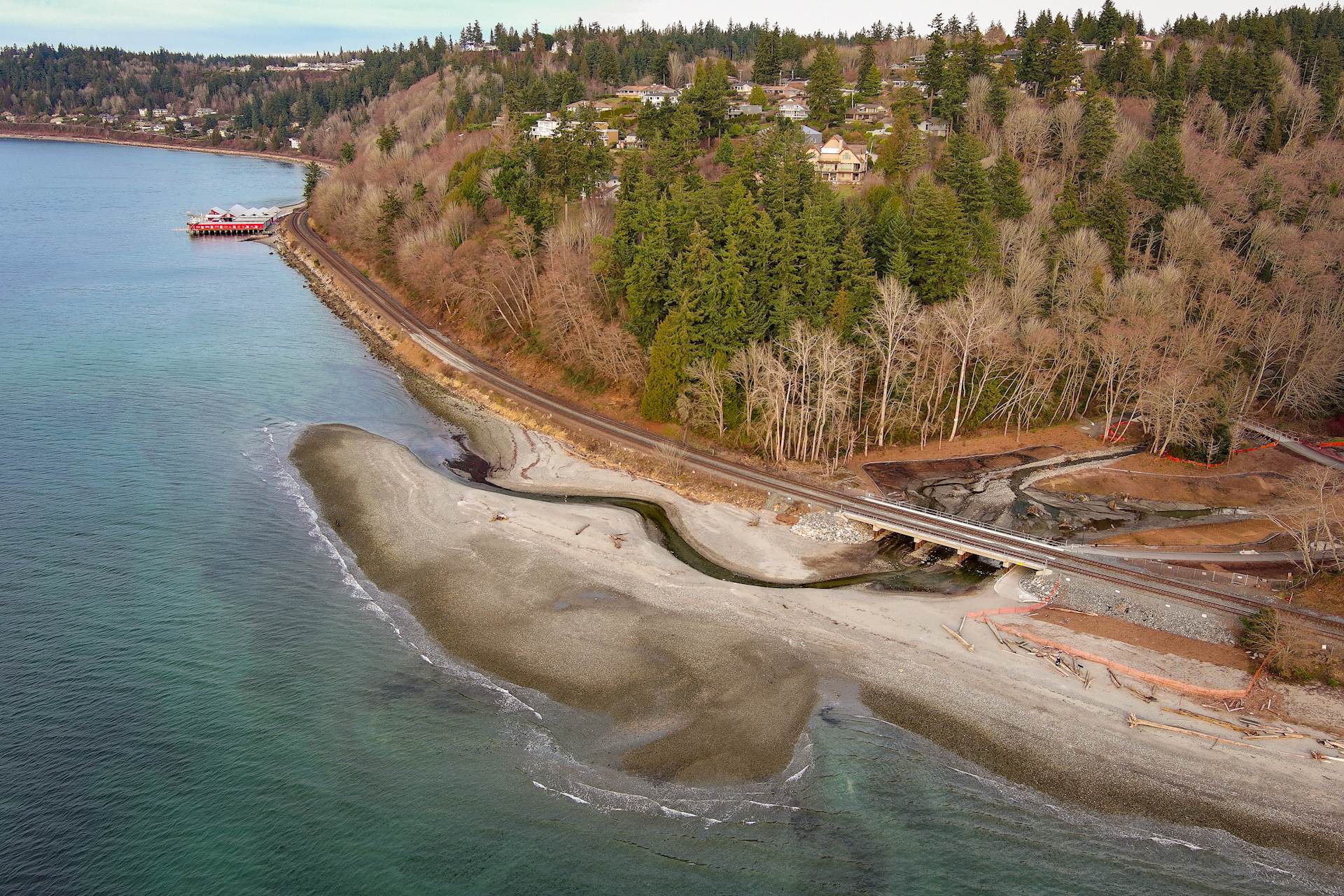 Aerial view of the replaced rail bridge culvert over the restored estuary at the coastal Meadowdale Beach Park