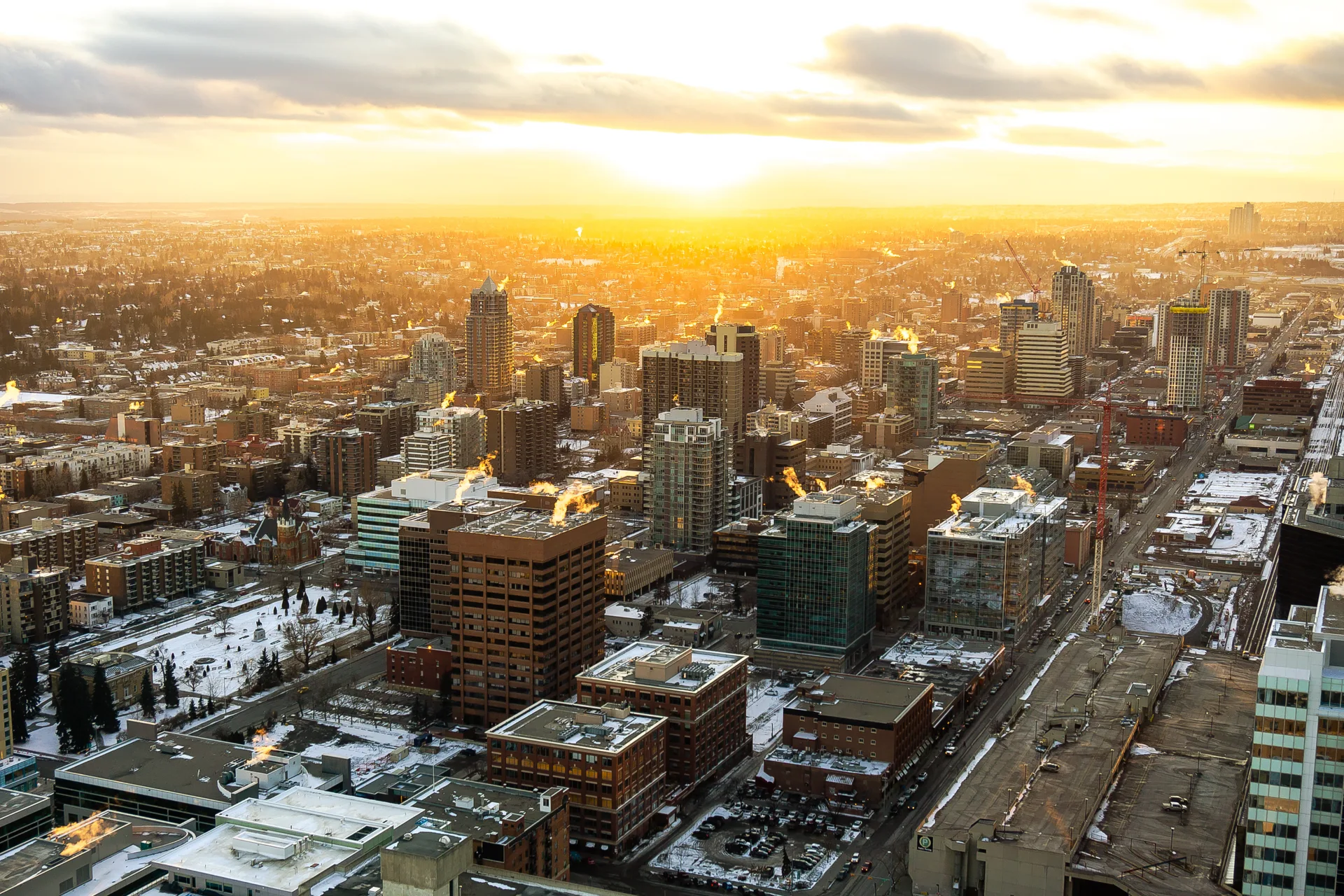 Calgary City Urban Sunset. Sunset over the city of Calgary in winter. Taken from the Calgary Tower overlooking the south-west downtown side of the urban city.