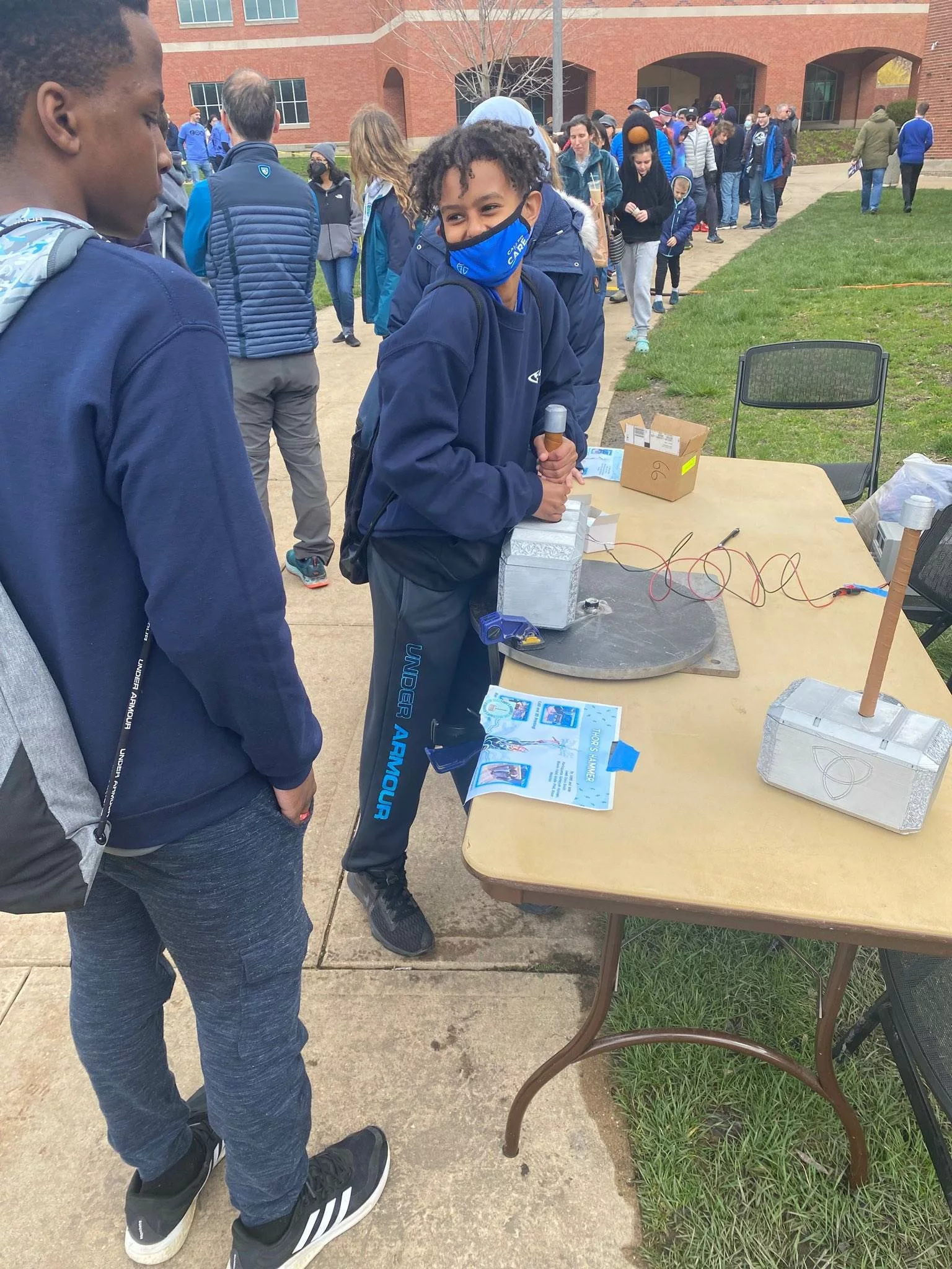 a student tries out an exhibit at the open house