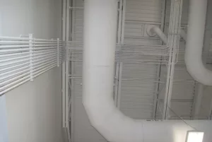 White-painted ceiling with mechanical piping