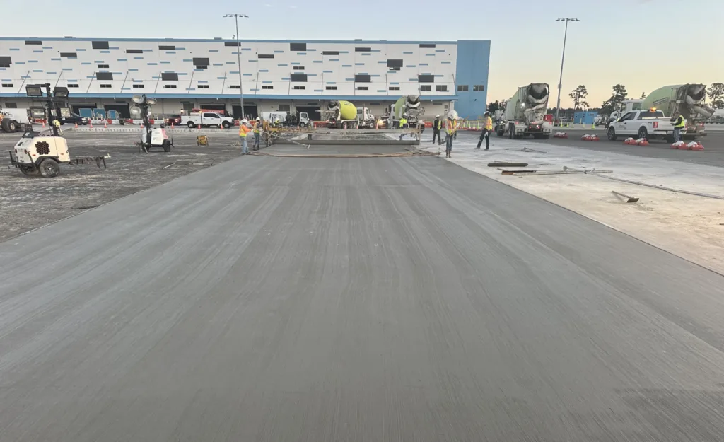 Long stretch of pavement leading up to building with checked pattern