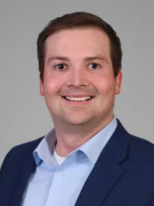 headshot of Tom Considine