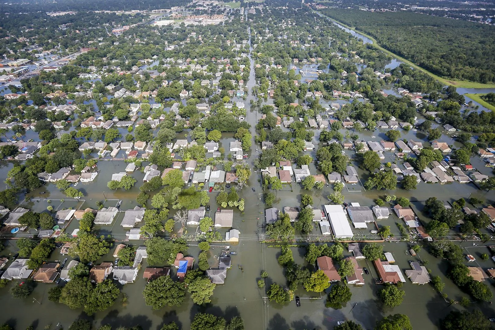 Aerial photo of rows of houses underwater after flooding