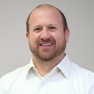 headshot of Travis Shannon