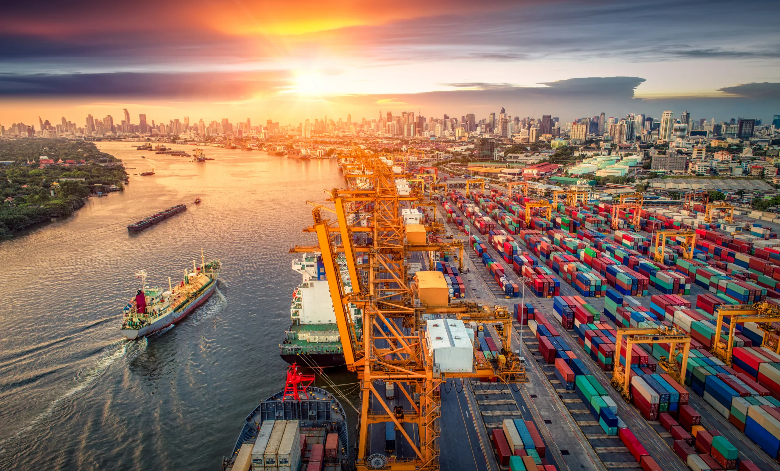 Logistics and transportation of Container Cargo ship and Cargo plane with working crane bridge in shipyard at sunrise, logistic import export and transport industry background