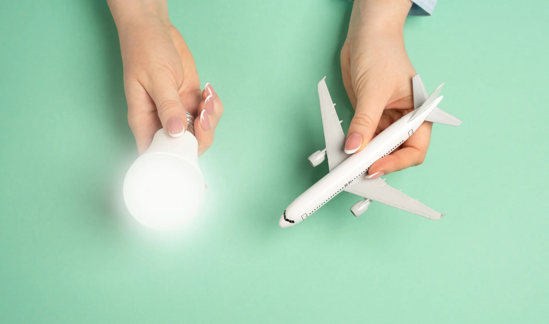 Light bulb idea and airline passenger plane. Innovative ideas in aviation. Efficient flight planning, business strategies in the travel industry. New travel solutions, airline improvements.