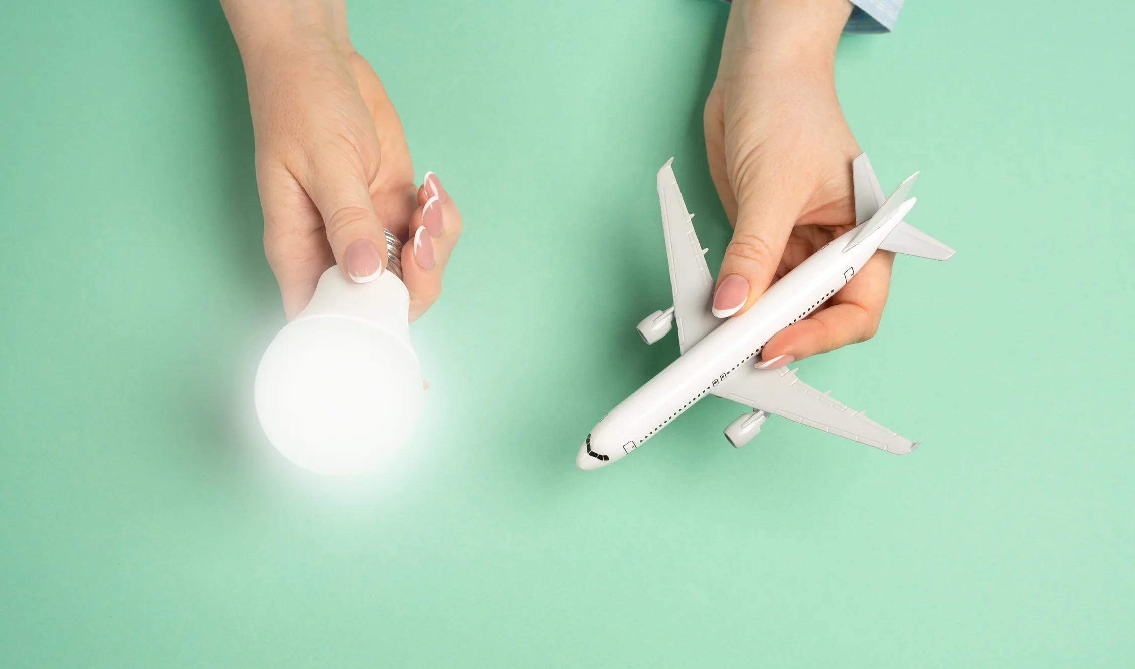 Light bulb idea and airline passenger plane. Innovative ideas in aviation. Efficient flight planning, business strategies in the travel industry. New travel solutions, airline improvements.