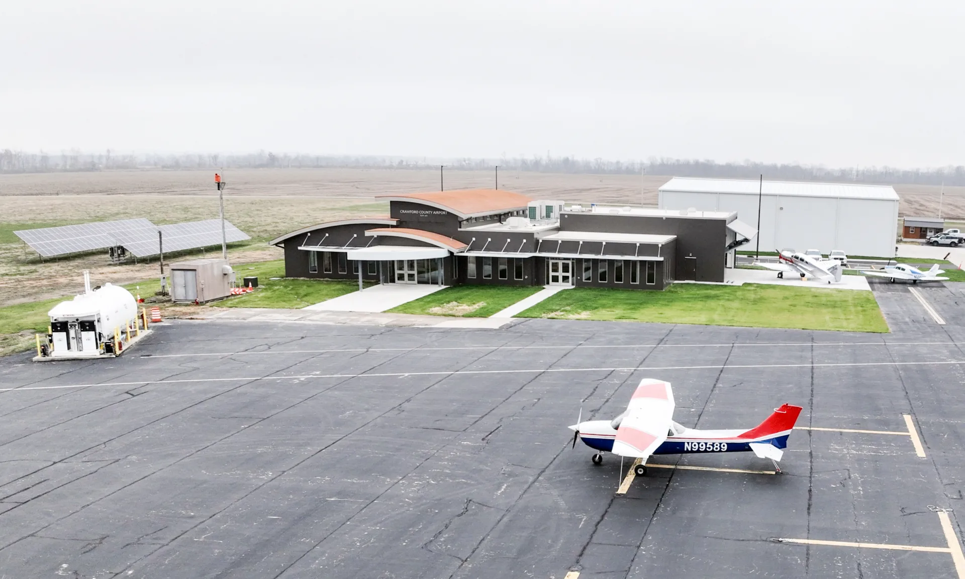 aerial view of a new terminal building at Crawford County Airport with farm fields surrounding the airport