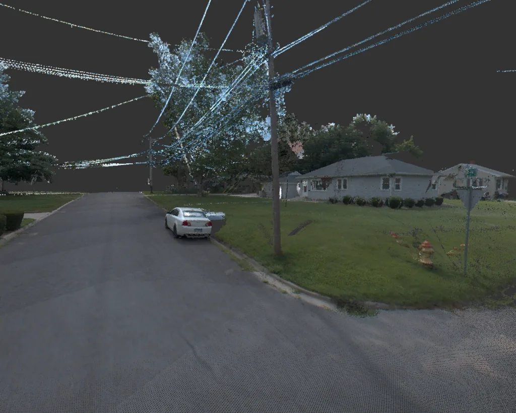 Night vision photo of power poles and lines damaged after storm, with car in center and house in background at right